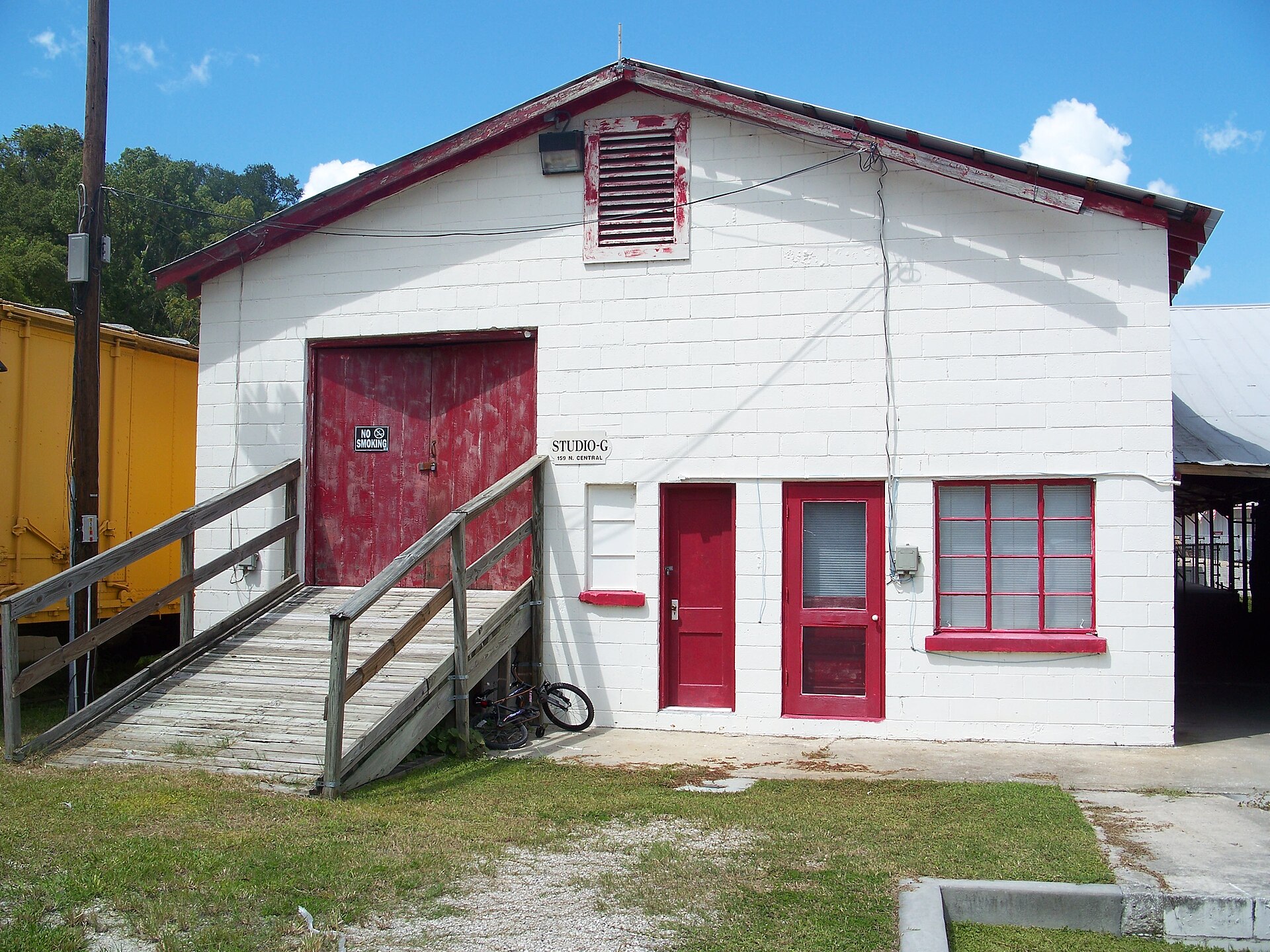 The R. W. Estes Celery Company precooler, a low industrial building with red doors